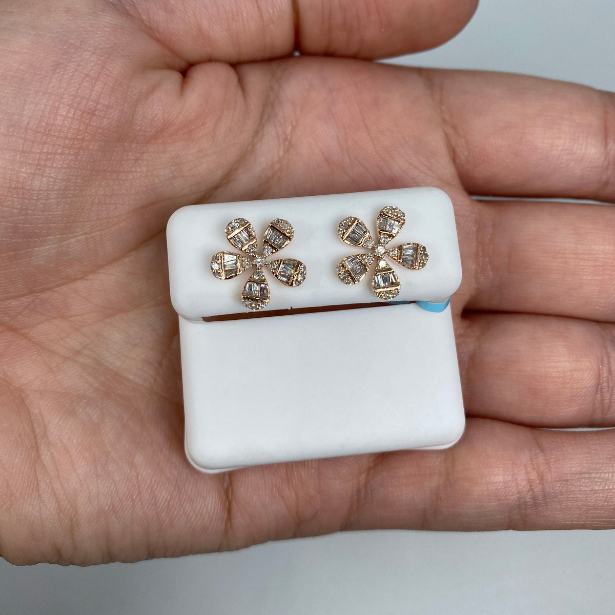 14K Gold Flower Baguette Diamond Earrings in rose gold - close-up product photo