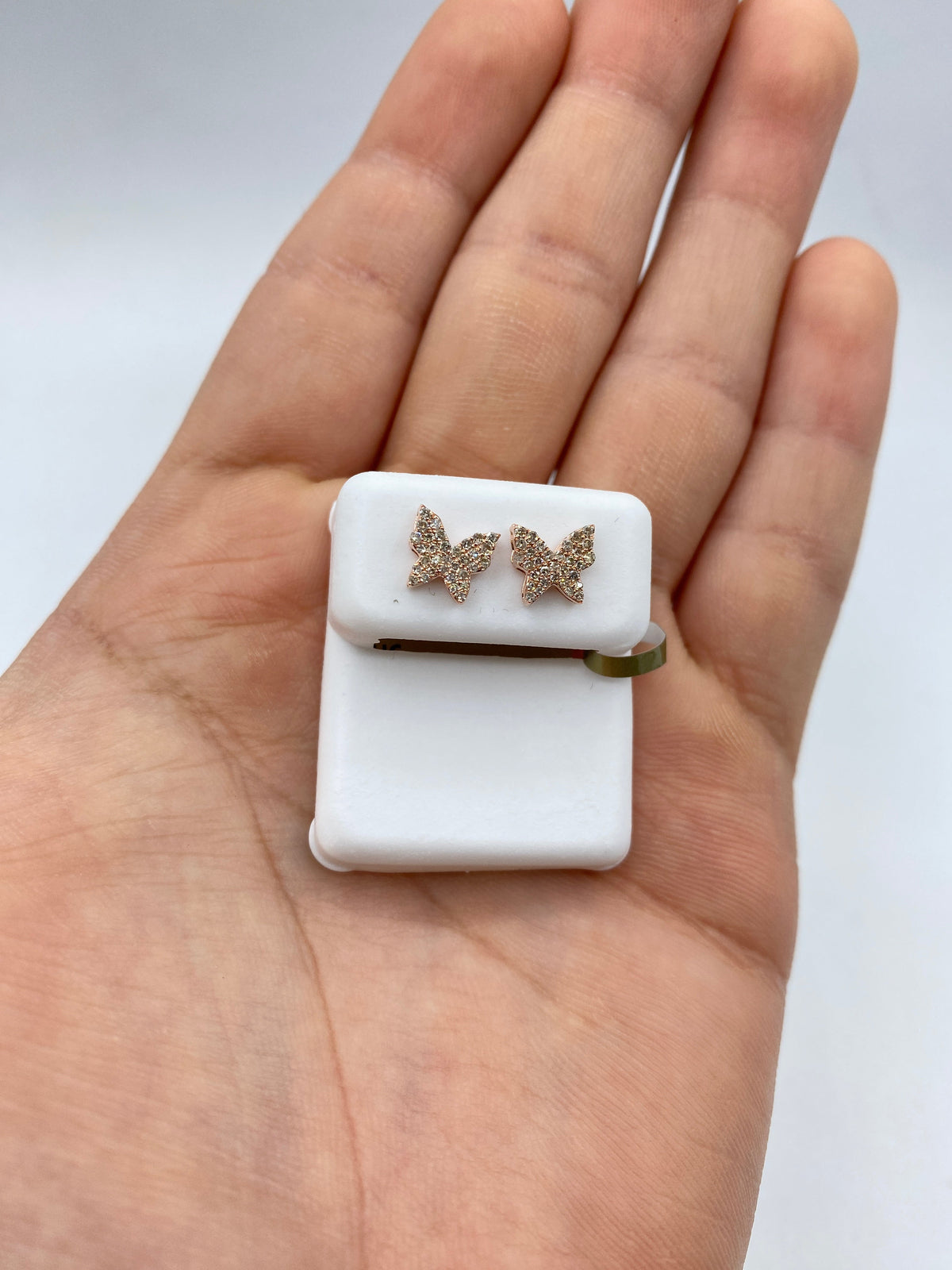 10K Gold Butterfly Diamond Earrings in rose gold - close-up product photo