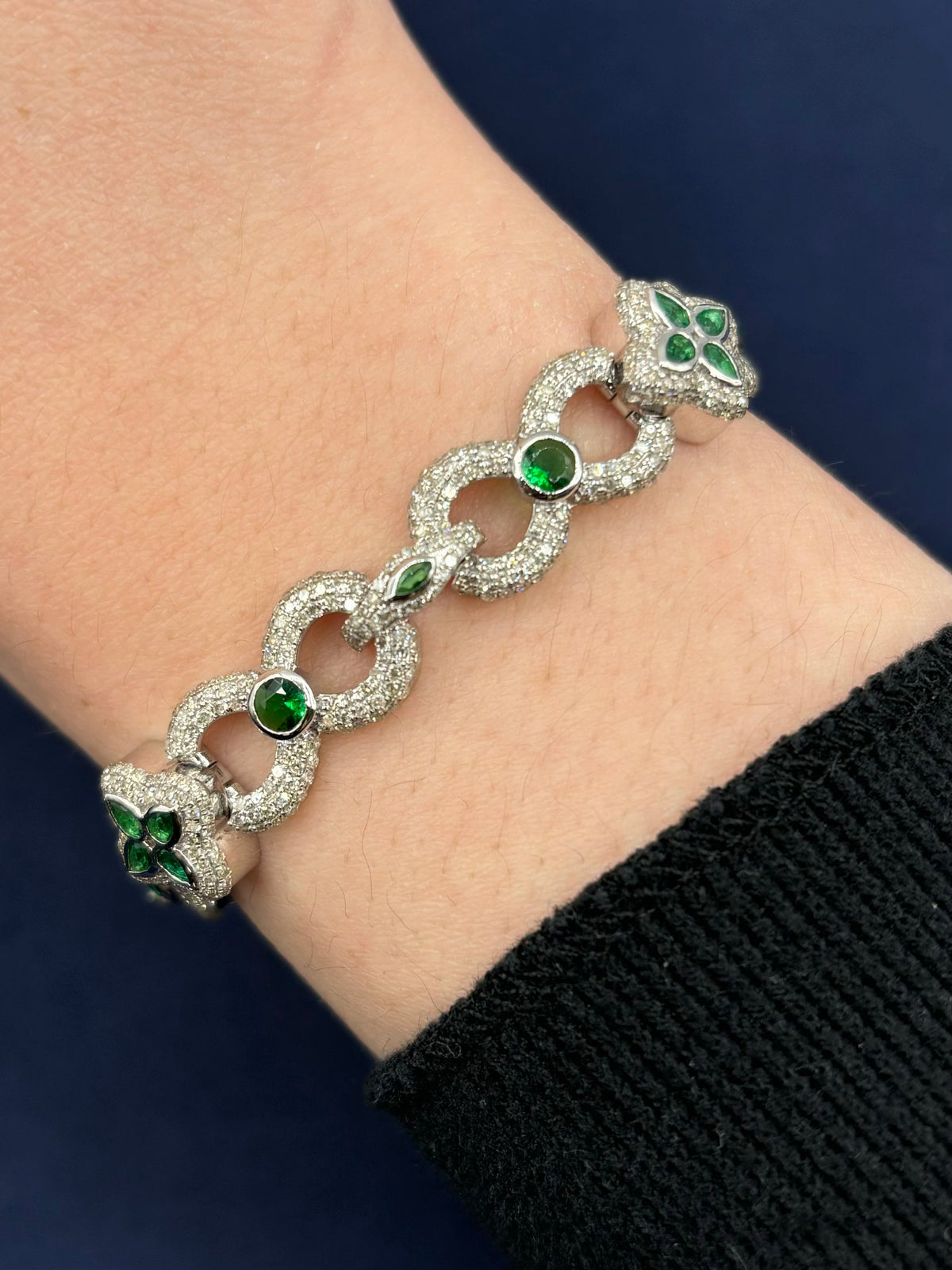 10K Gold Infinity Flower Diamond & Green Gemstone Bracelet in white gold - close-up product photo