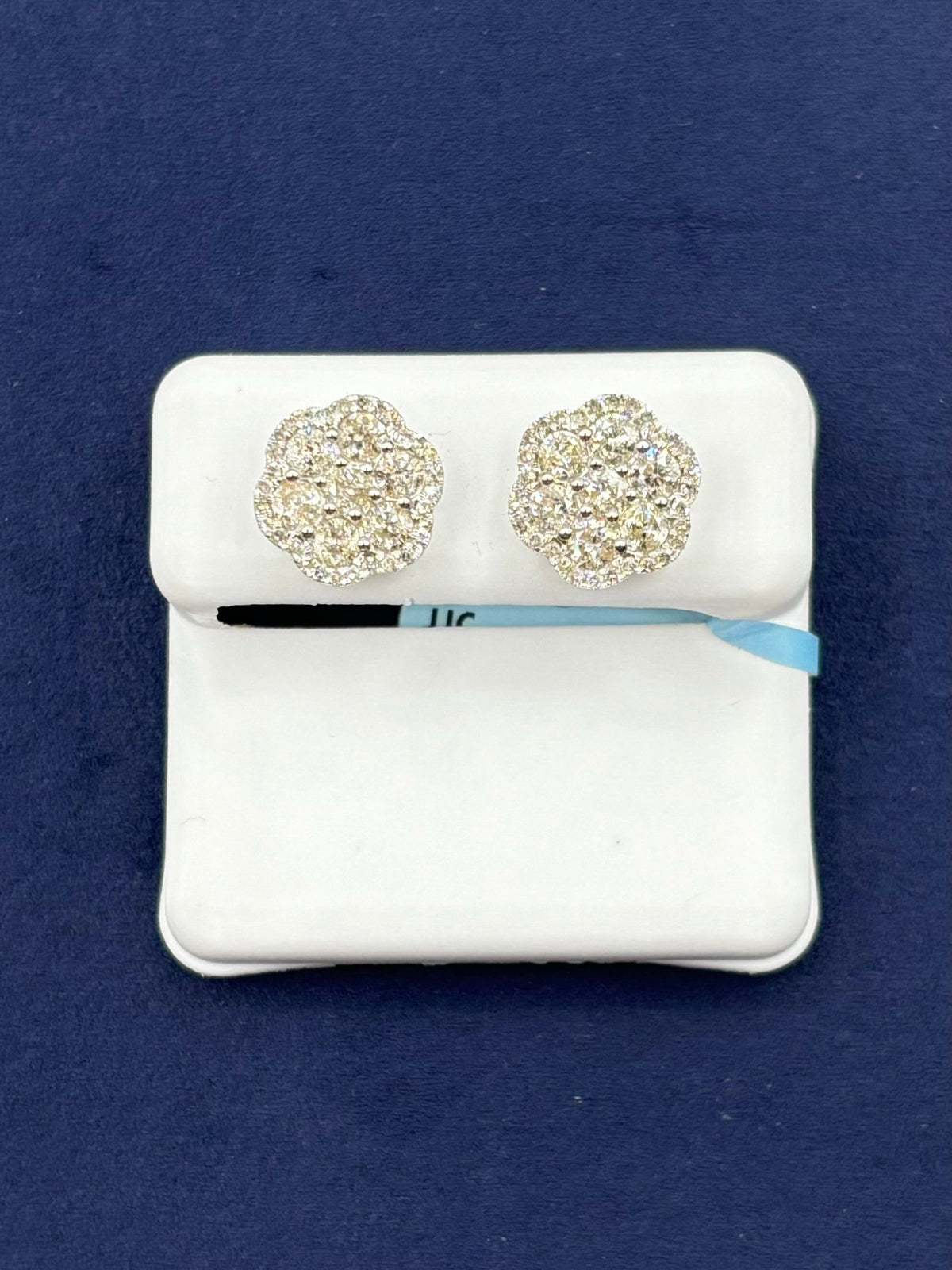 14K Gold Jumbo Halo Diamond Flower Earrings in white gold - close-up product photo