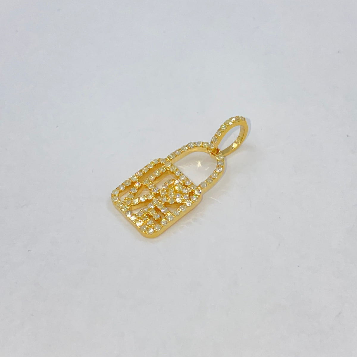 14K Gold Love Lock Diamond Pendant in yellow gold - close-up product photo
