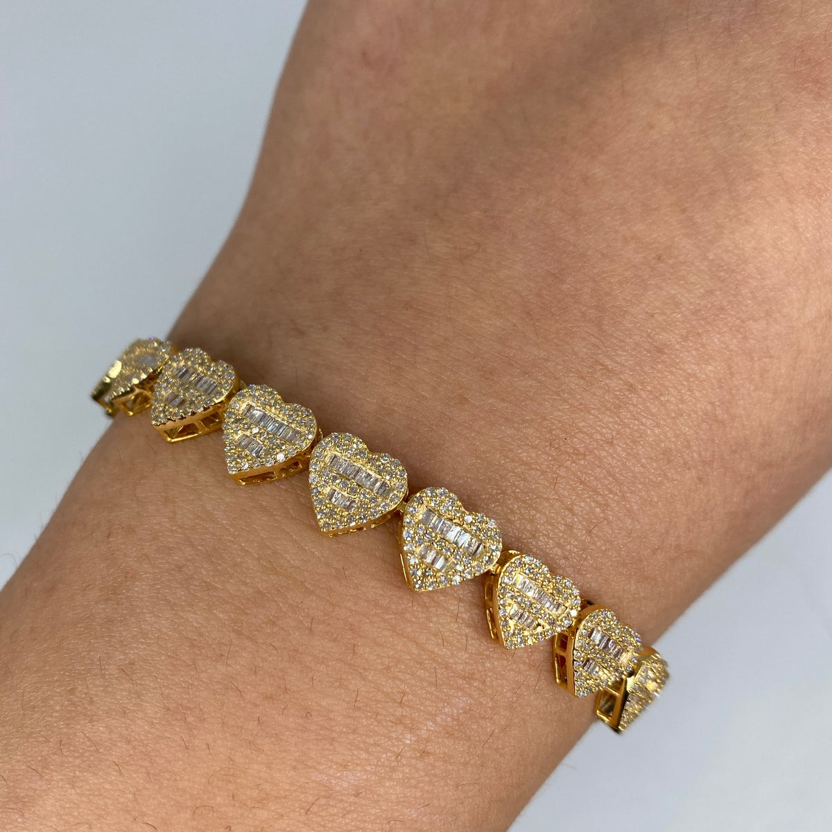 14K Gold 9mm Hearts Link Diamond Baguette Bracelet 6.5–7.5 in in yellow gold, 6.5" - close-up product photo