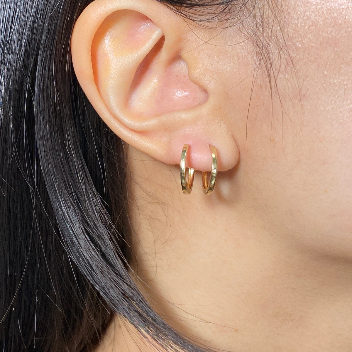 14K Solid Gold Slim Hoop Earrings in yellow gold - close-up product photo