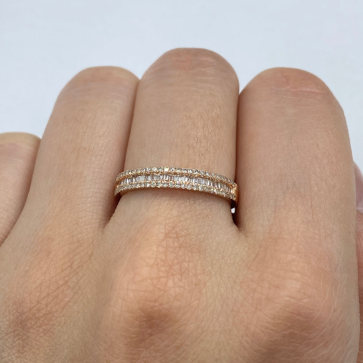 10K Gold Diamond Baguette Band in rose gold, 3.3mm - close-up product photo