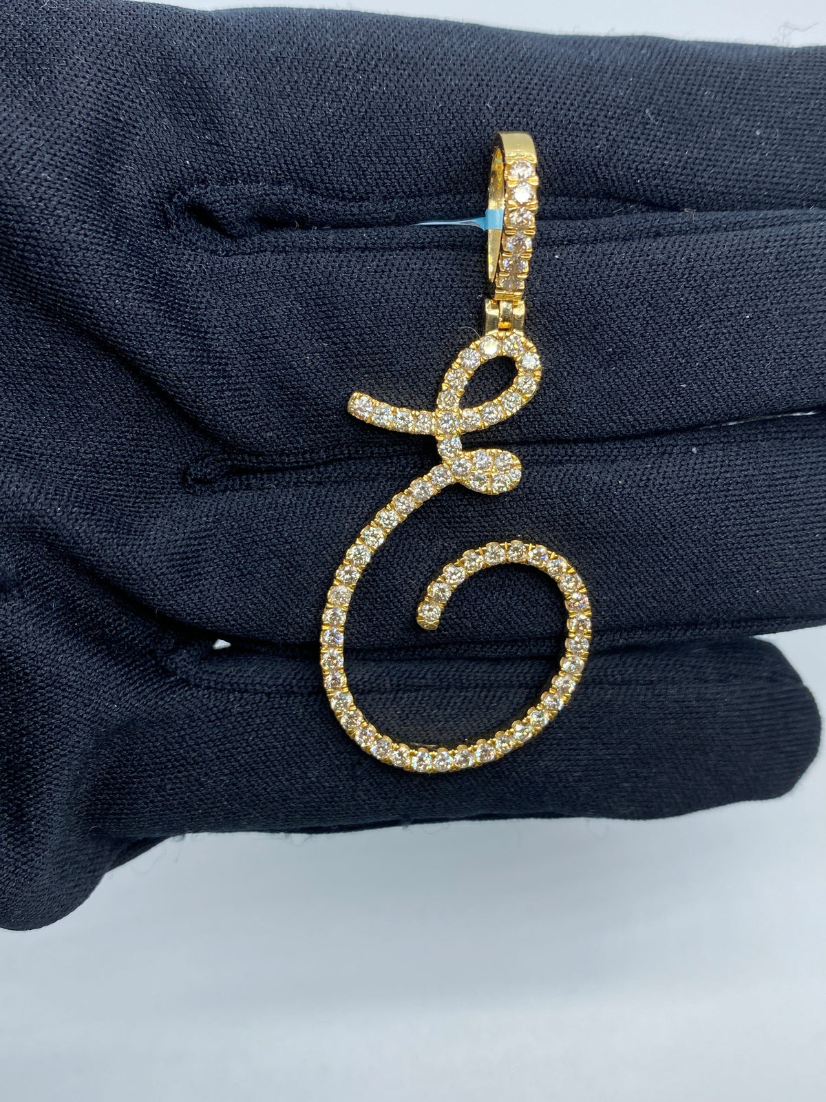 14K Gold Initial E Large Script Diamond Pendant in yellow gold - close-up product photo