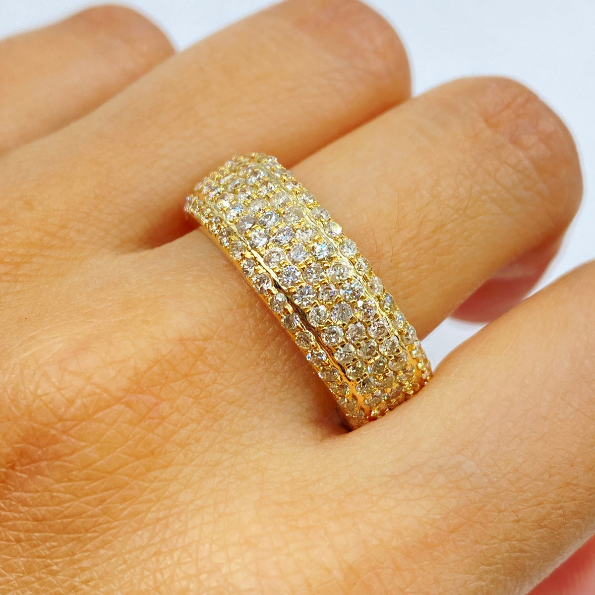 14K Gold 7.4mm Iced Stack Diamond Ring Band in yellow gold - close-up product photo