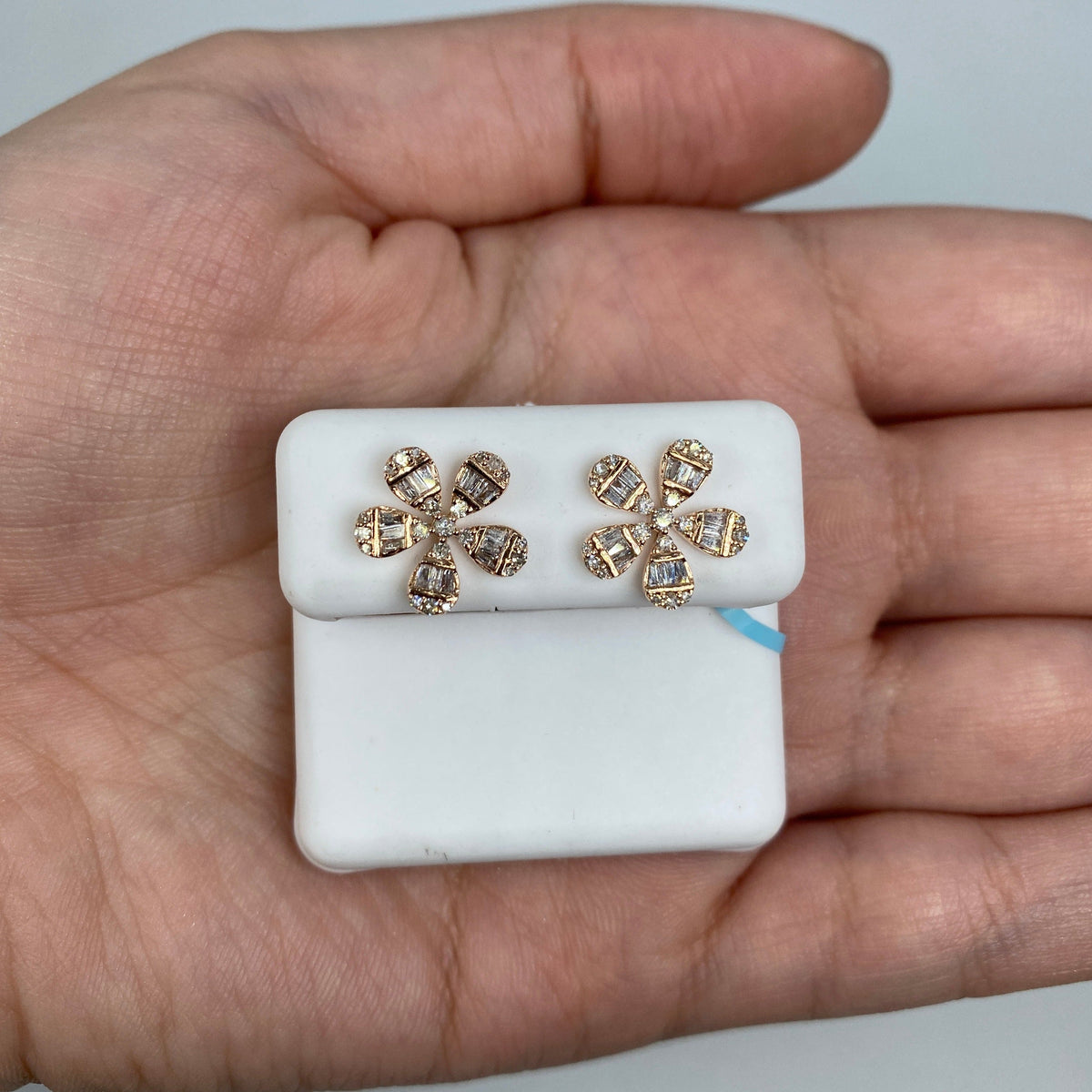 14K Gold Flower Baguette Diamond Earrings in white gold - close-up product photo