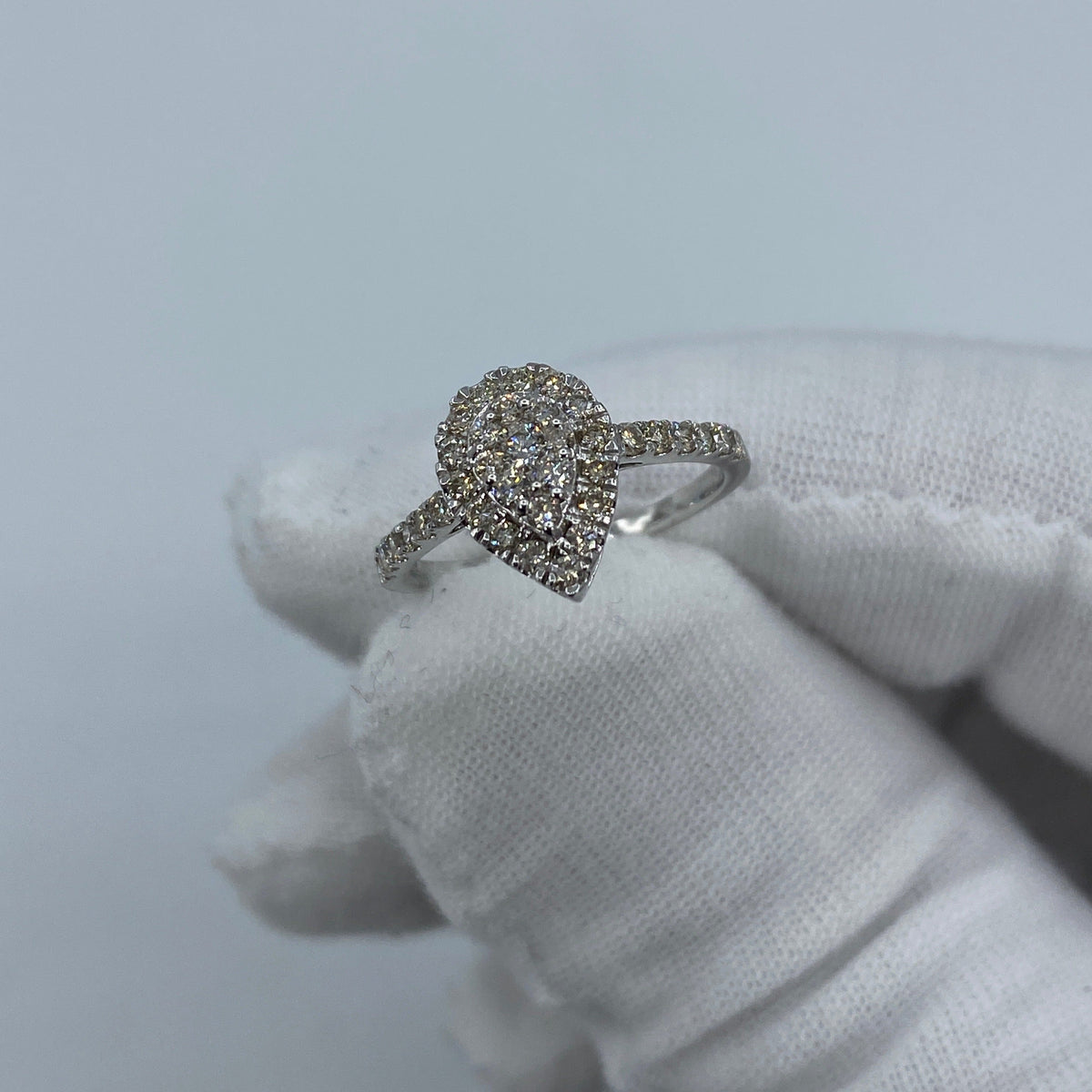 14K Gold Small Pear Shape Diamond Engagement Ring in white gold - close-up product photo