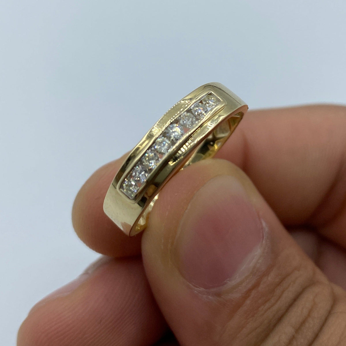 10K Gold Diamond Wedding Band in yellow gold - close-up product photo