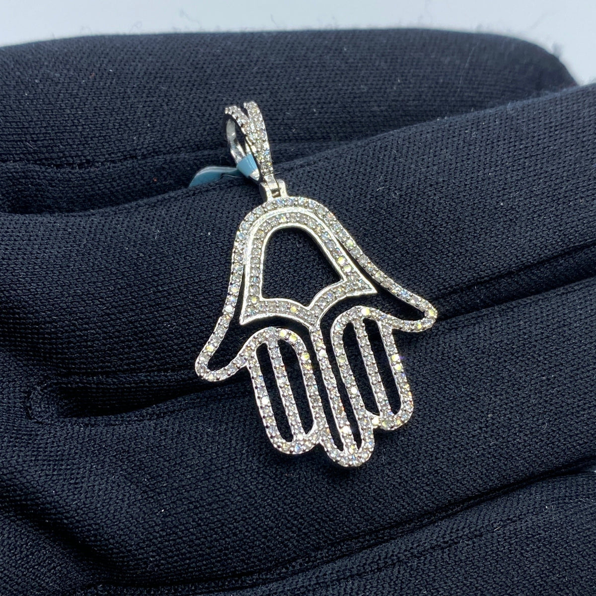 14K Gold Hamsa Diamond Pendant in white gold - close-up product photo