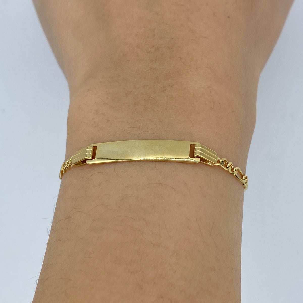 10K Gold Custom Name Plate Figaro Link Baby Diamond Bracelet, 5.5mm - close-up product photo