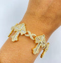 10K Gold Baguette Cross Infinity Diamond Bracelet in yellow gold - close-up product photo