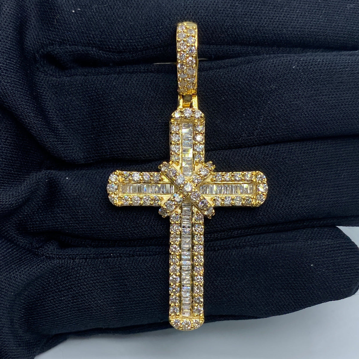 10K Gold Knot Diamond Cross Pendant in yellow gold - close-up product photo