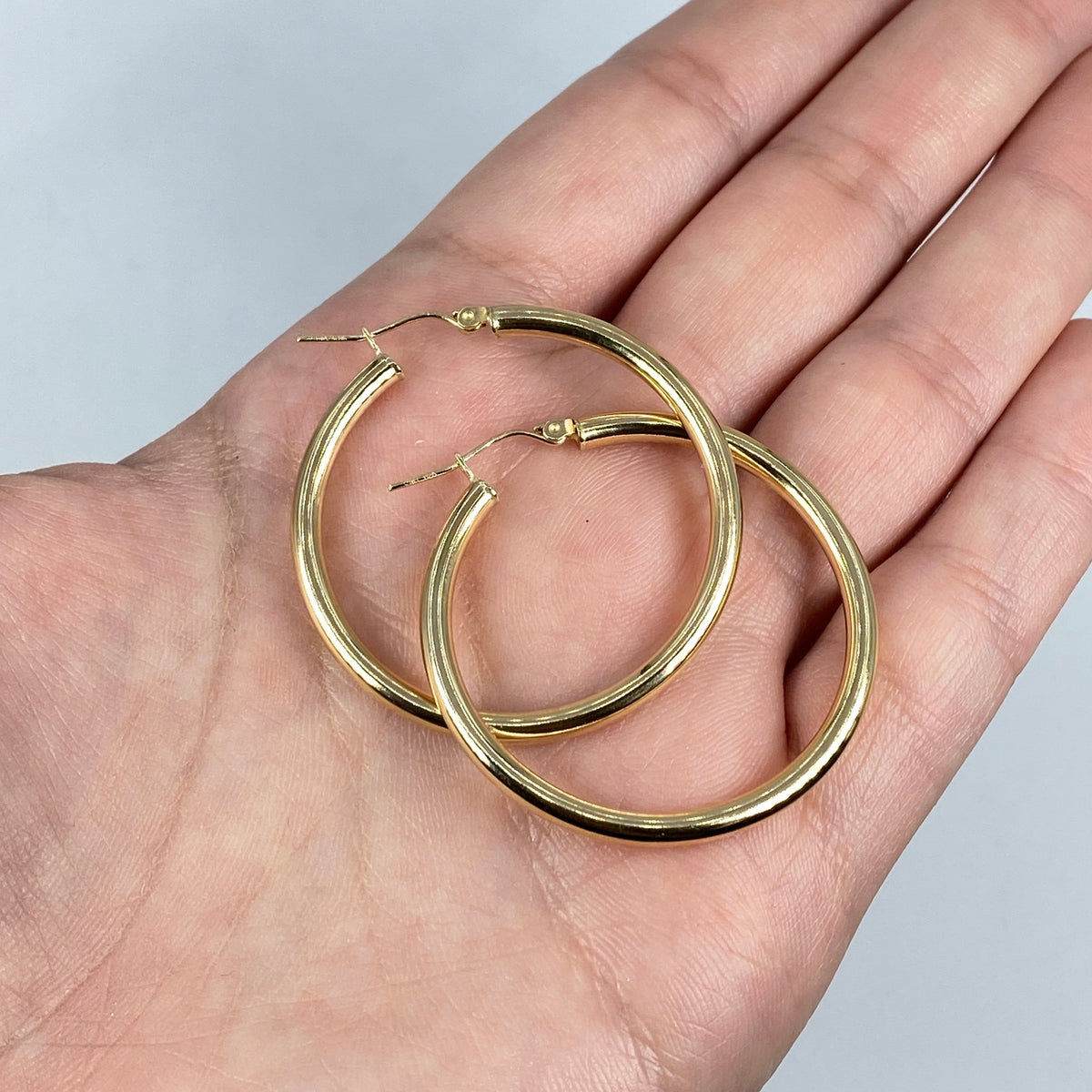 10K 3.2mm Yellow Gold Hoop Earrings, 35mm - close-up product photo