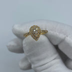 14K Gold Small Pear Shape Diamond Engagement Ring in yellow gold - close-up product photo