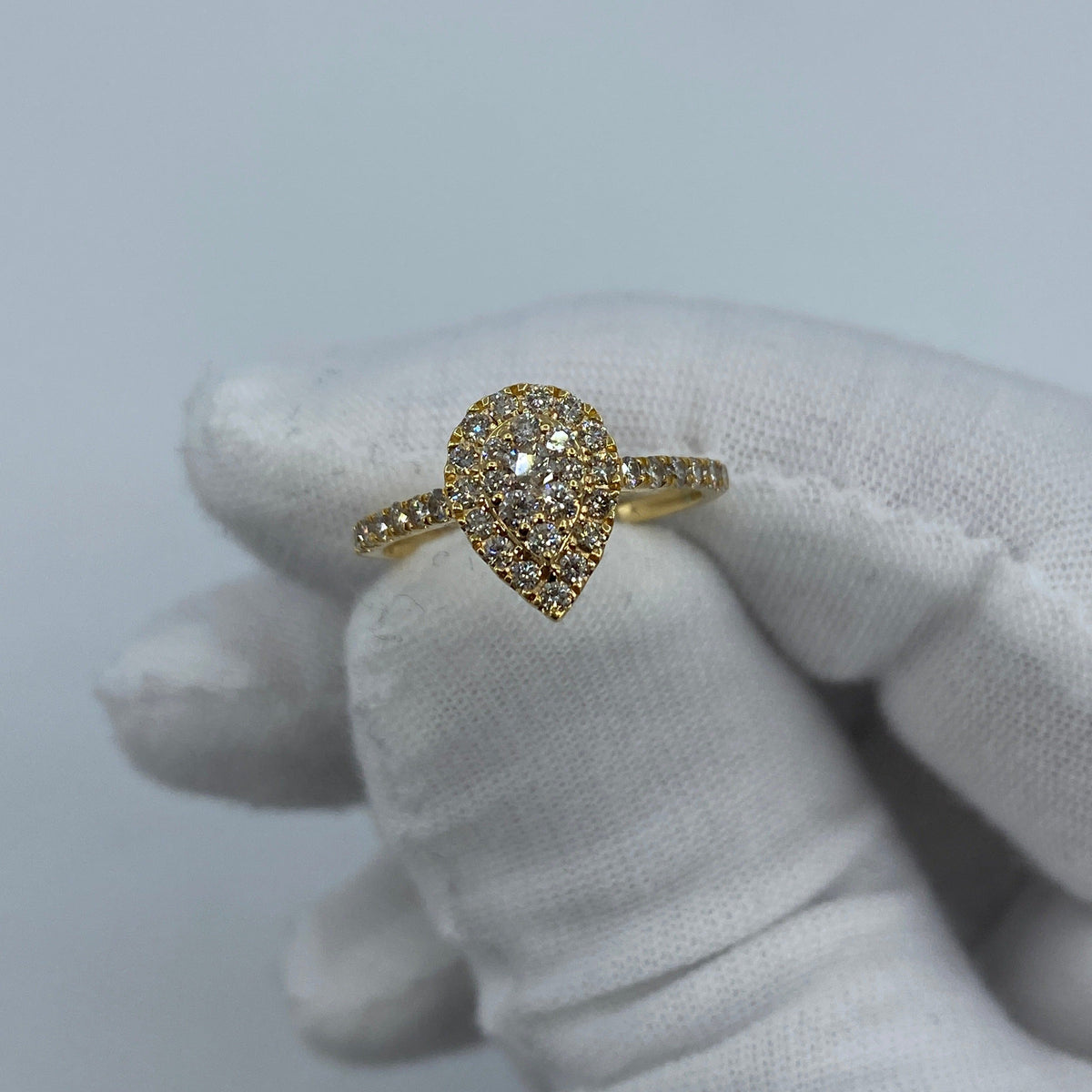 14K Gold Small Pear Shape Diamond Engagement Ring in yellow gold - close-up product photo