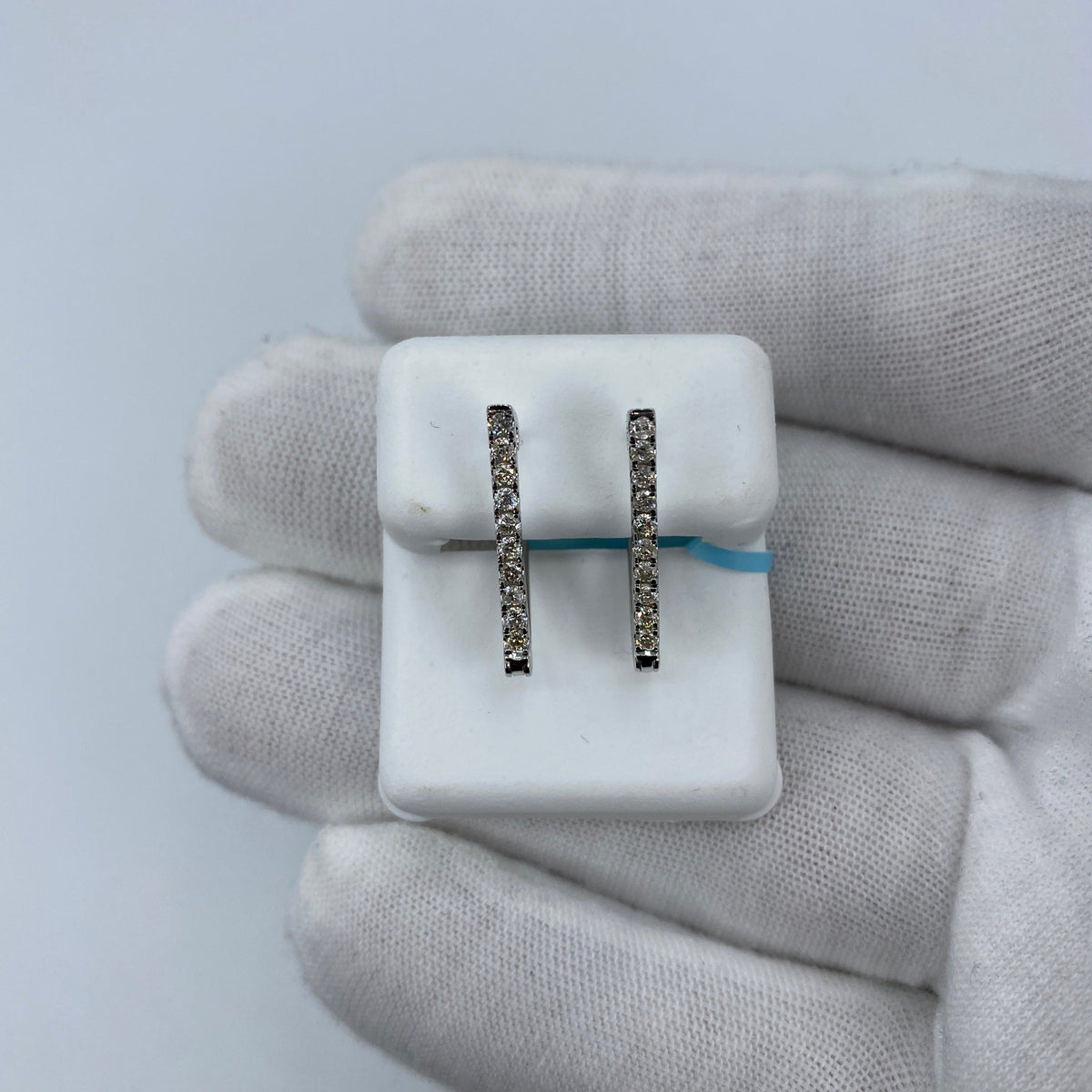 14K Gold Triangle Hoop Diamond Earrings in white gold - close-up product photo