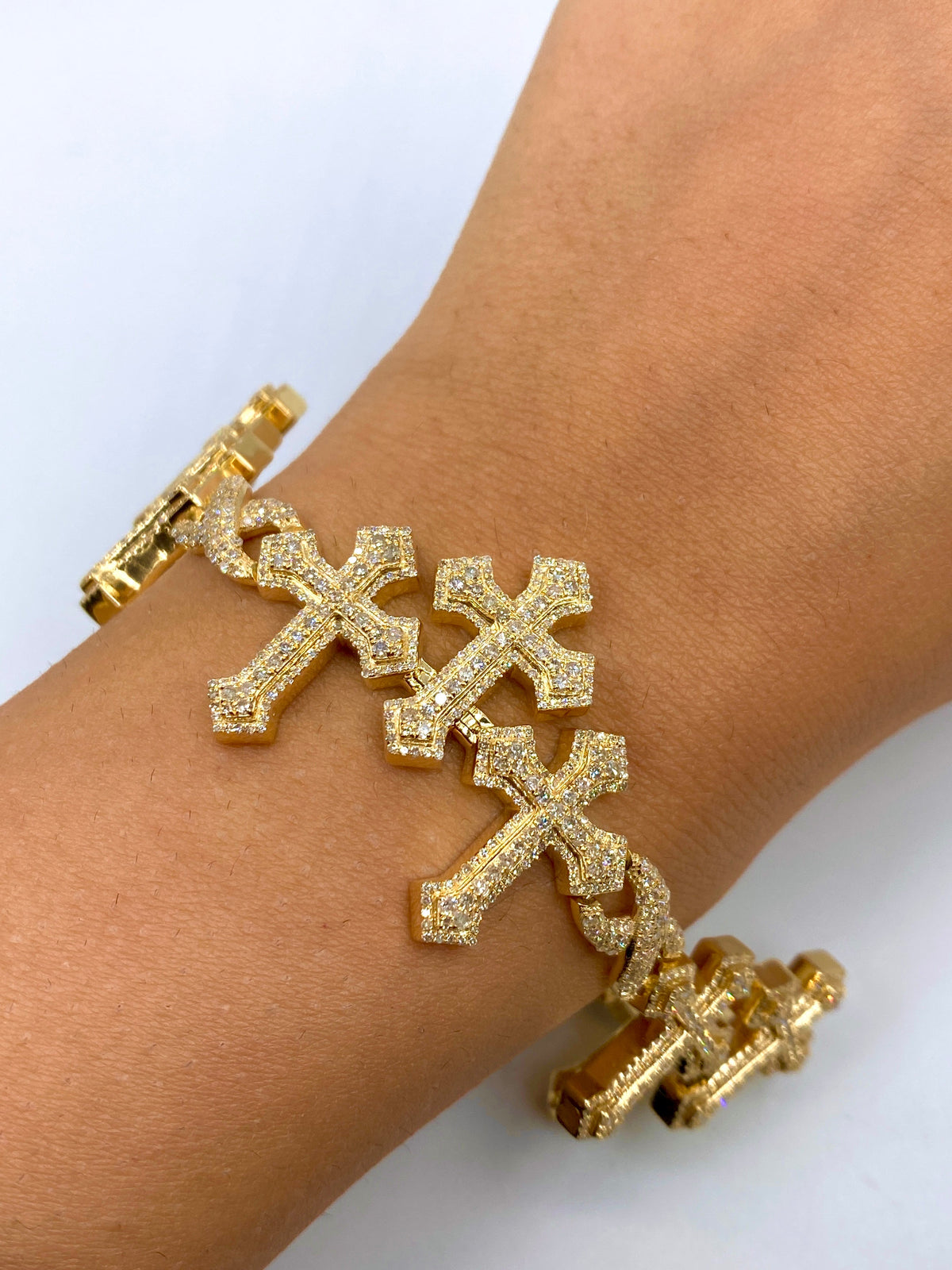 10K Gold Triple Infinity Cross Diamond Bracelet in yellow gold - close-up product photo