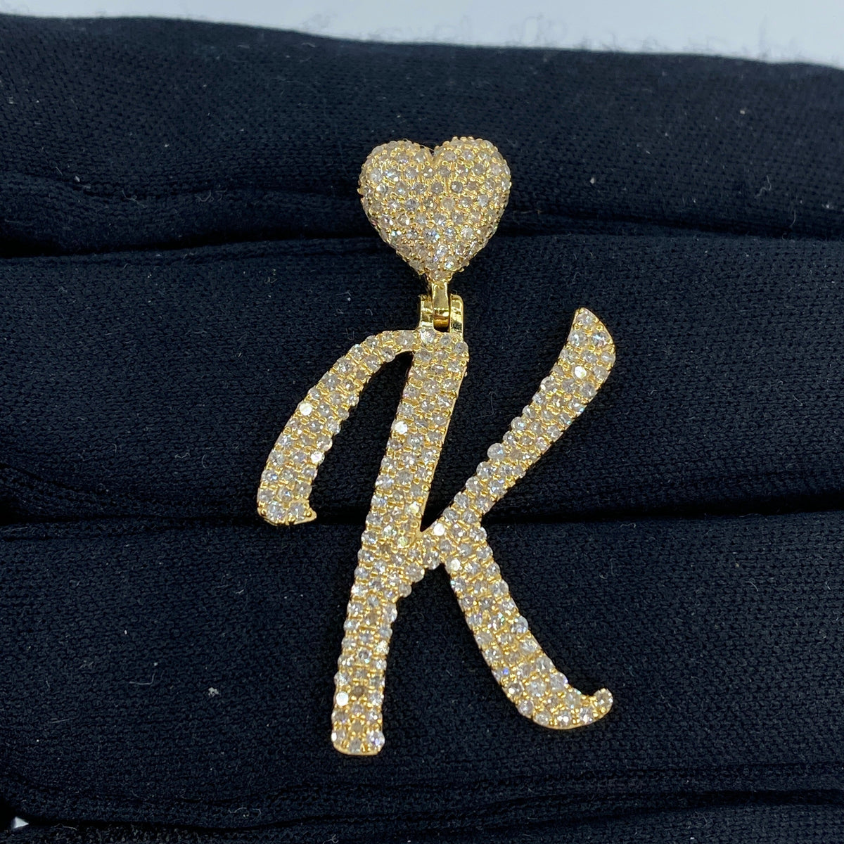 14K Gold Initial K Script Heart Diamond Pendant in yellow gold - close-up product photo