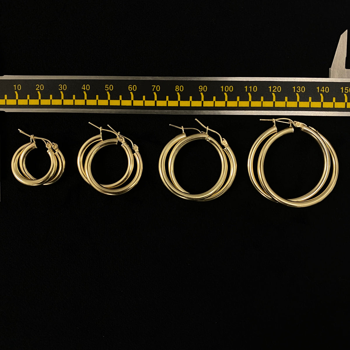 10K 3.2mm Yellow Gold Hoop Earrings, 25mm - close-up product photo