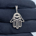 14K Gold Hamsa Evil Eye Diamond Pendant in white gold - close-up product photo