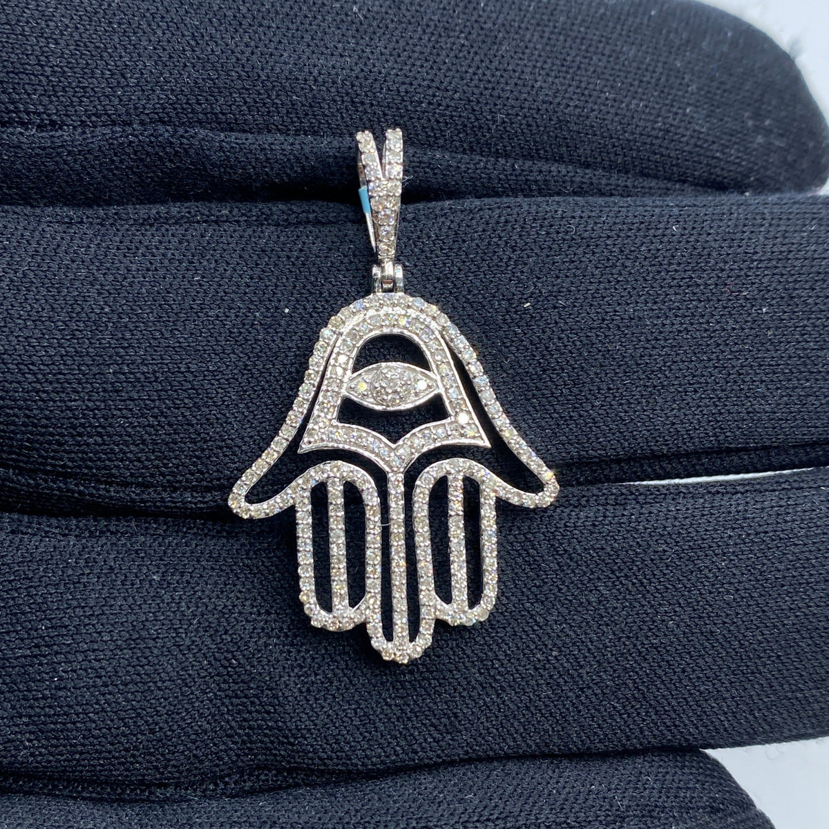 14K Gold Hamsa Evil Eye Diamond Pendant in white gold - close-up product photo