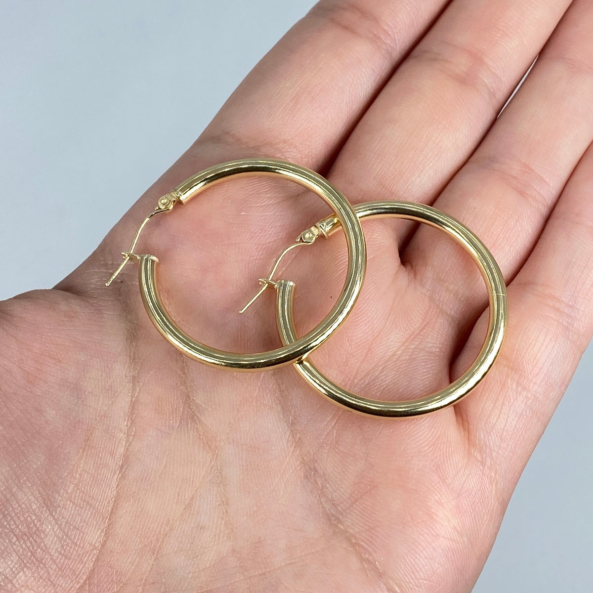 10K 3.2mm Yellow Gold Hoop Earrings, 30mm - close-up product photo