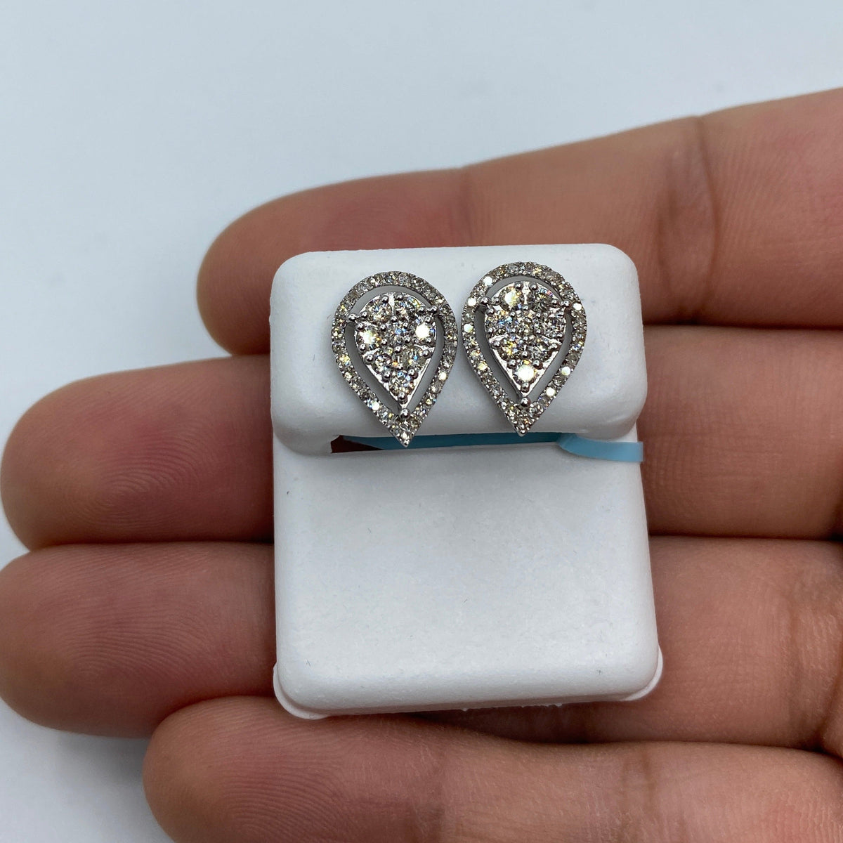 14K Gold Pear Shaped Halo Diamond Earrings in white gold - close-up product photo