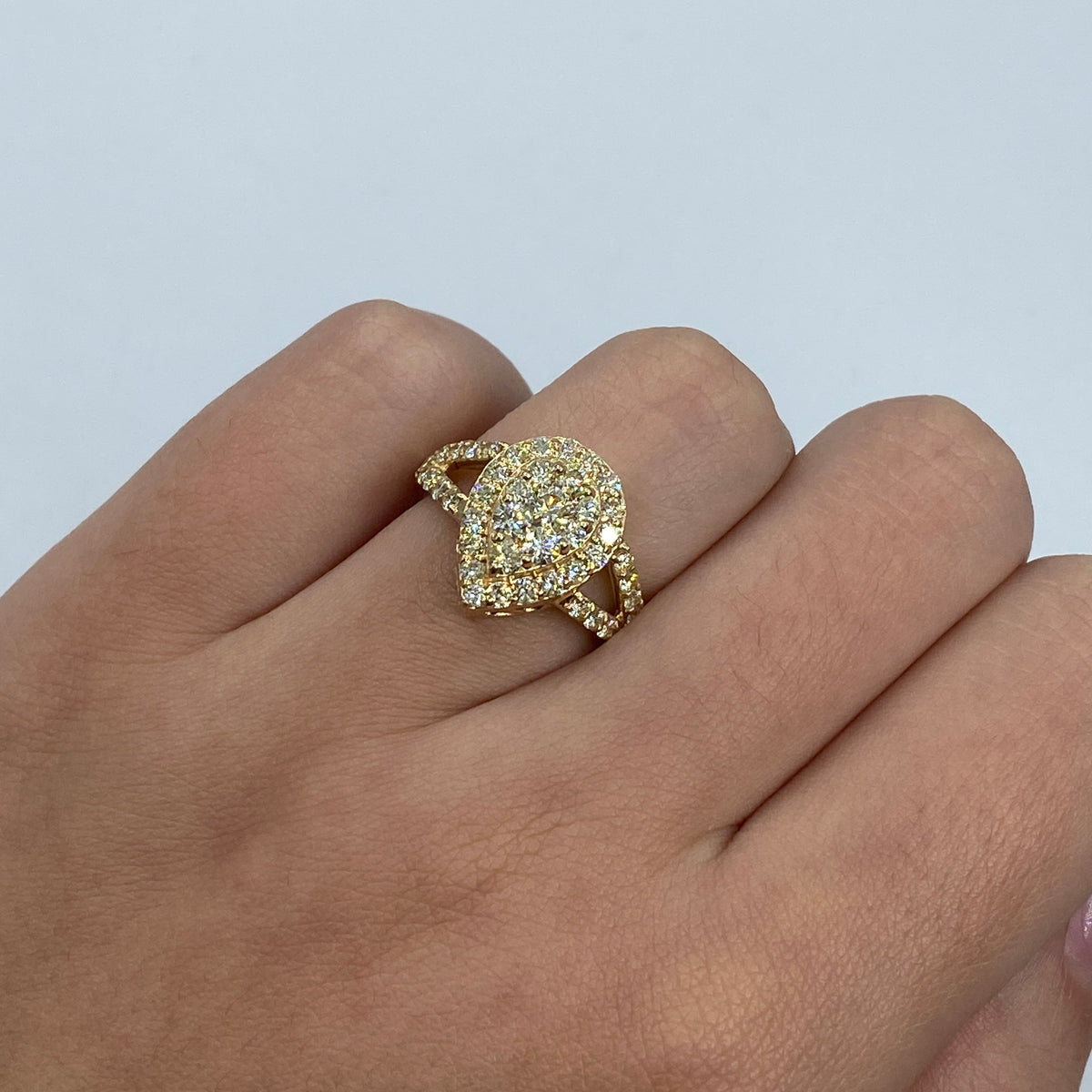 14K Gold Cherish Halo Pear Diamond Engagement Ring in yellow gold - close-up product photo