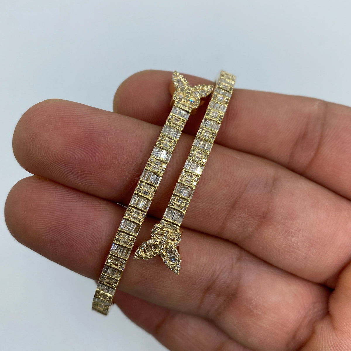 10K Gold Bangle Butterfly Diamond Baguette Bracelet in yellow gold - close-up product photo