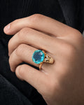Male model wearing 10k Yellow Gold Cocktail Ring with Oval Aquamarine Cabochon