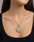 Female model wearing 18k Gold Regal Heart Diamond Pendant