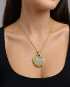 Female model wearing 18k Gold Regal Heart Diamond Pendant