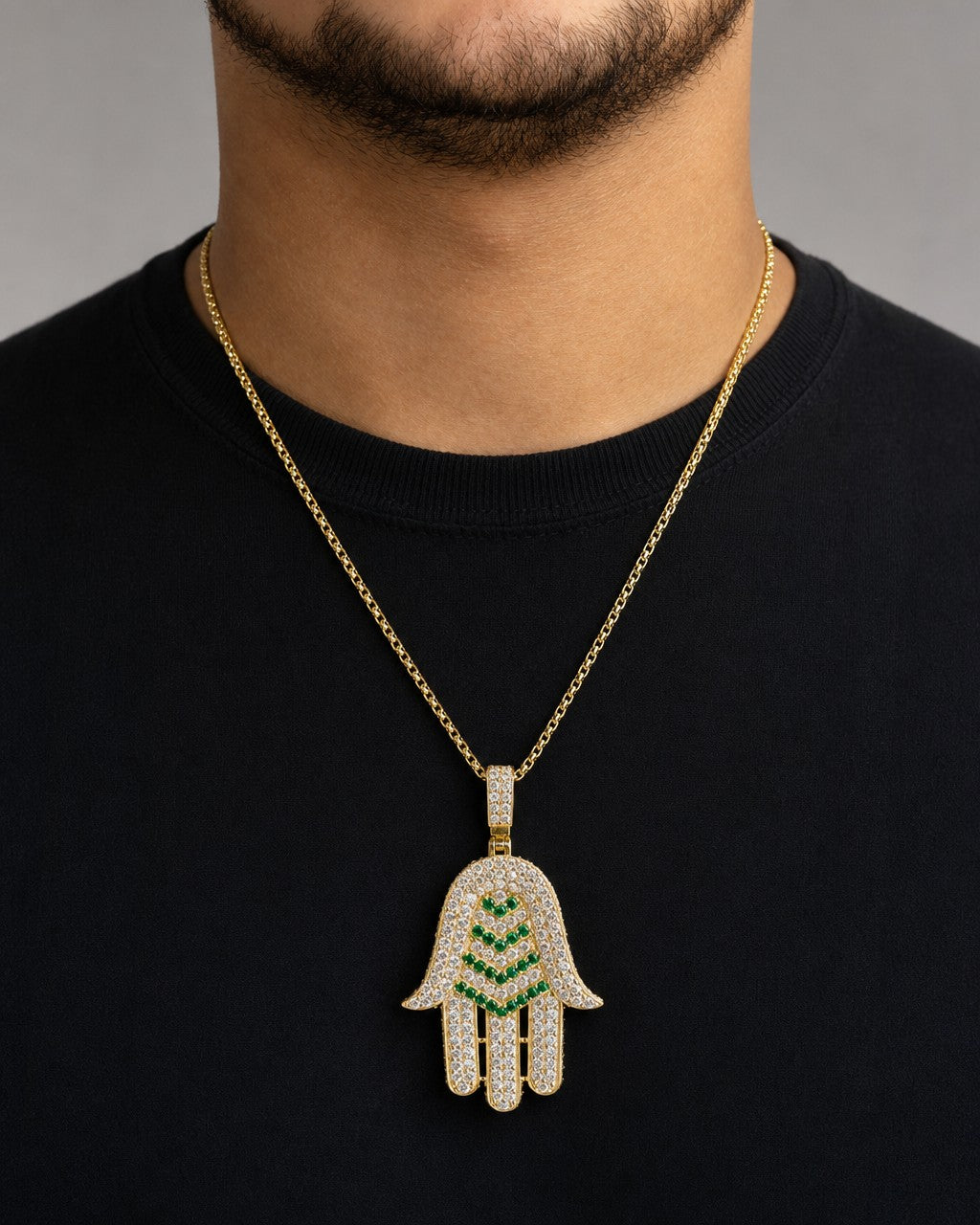 Male model wearing 14K Gold and Sapphire Stone Hamsa Pendant