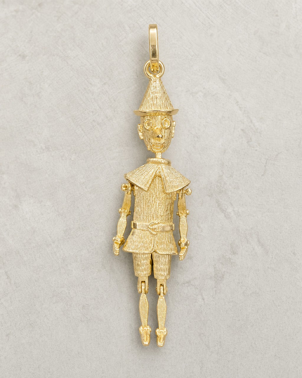 14K Gold Pinocchio Pendant styled photo