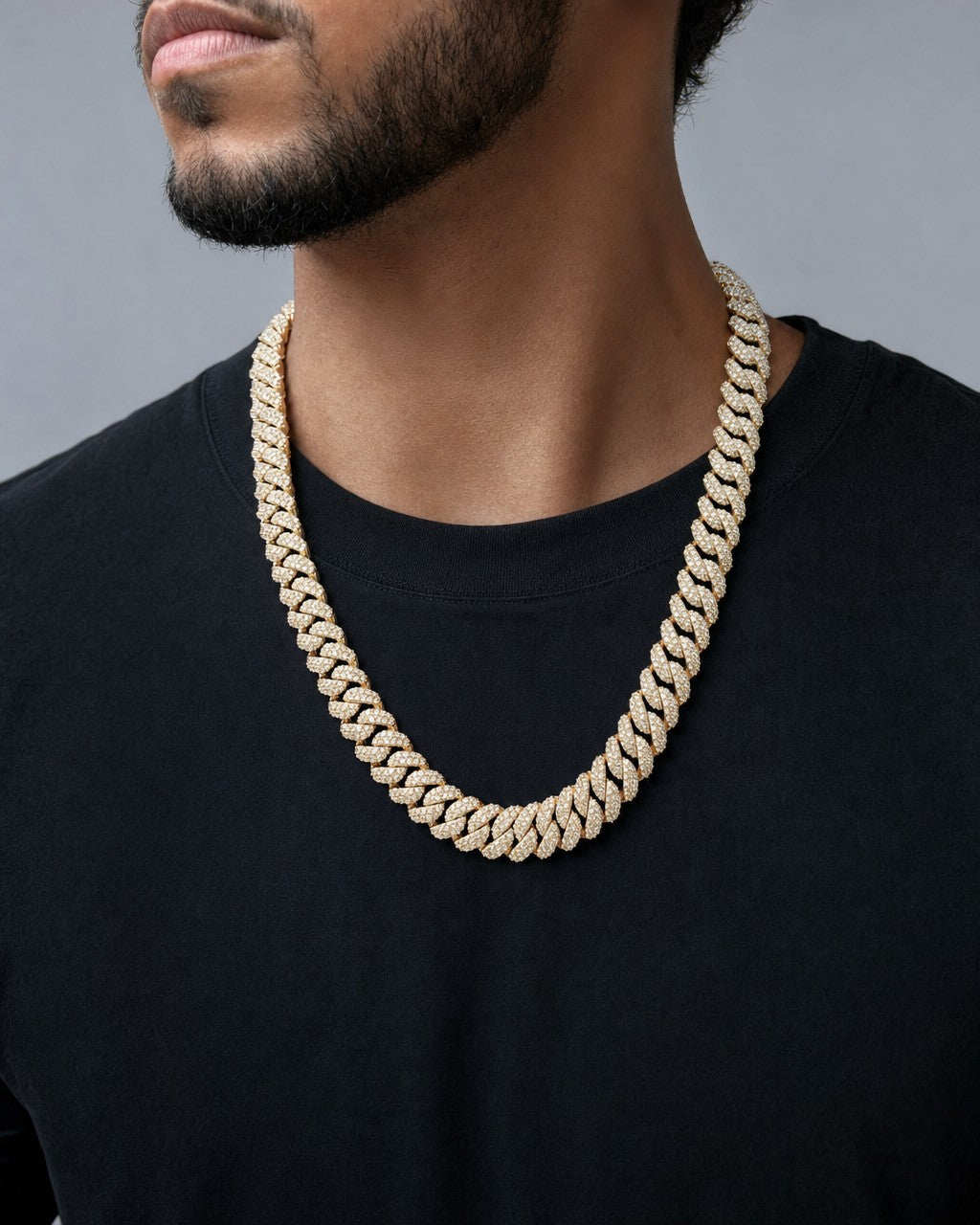 Male model wearing 10k Gold and Diamond 12.4MM Cuban Link Chain