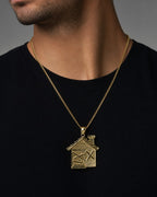 Male model wearing 10K Gold House Pendant