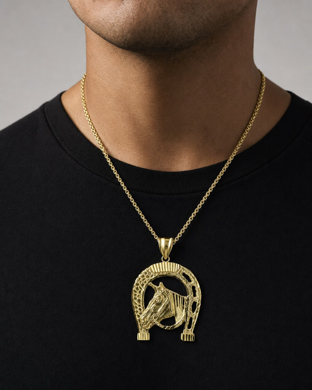 Male model wearing 10K Gold Horseshoe Pendant