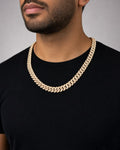 Male model wearing 10k Gold and Diamond 12.4MM Cuban Link Chain