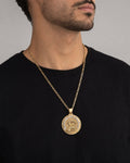 Male model wearing 14k Gold Caridad Del Cobre Pendant