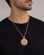 Male model wearing 14k Gold Caridad Del Cobre Pendant