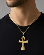 Male model wearing 10k cross pendant with Jesus￼