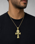 Male model wearing 10k cross pendant with parallel lines ￼