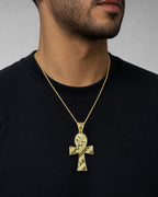 Male model wearing 10k cross pendant with parallel lines ￼