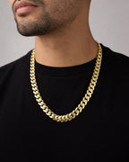 Male model wearing 14k Gold 13.3mm Miami Cuban Link Chain