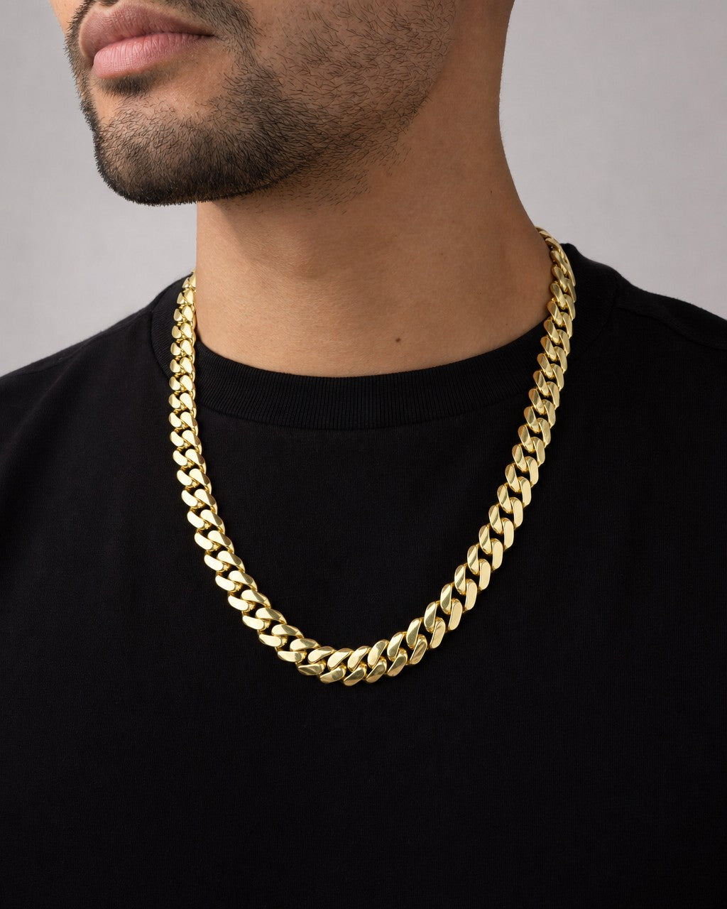 Male model wearing 14k Gold 13.3mm Miami Cuban Link Chain