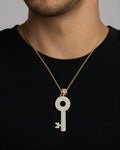Male model wearing 10K Gold White Sapphire Stone Key Pendant