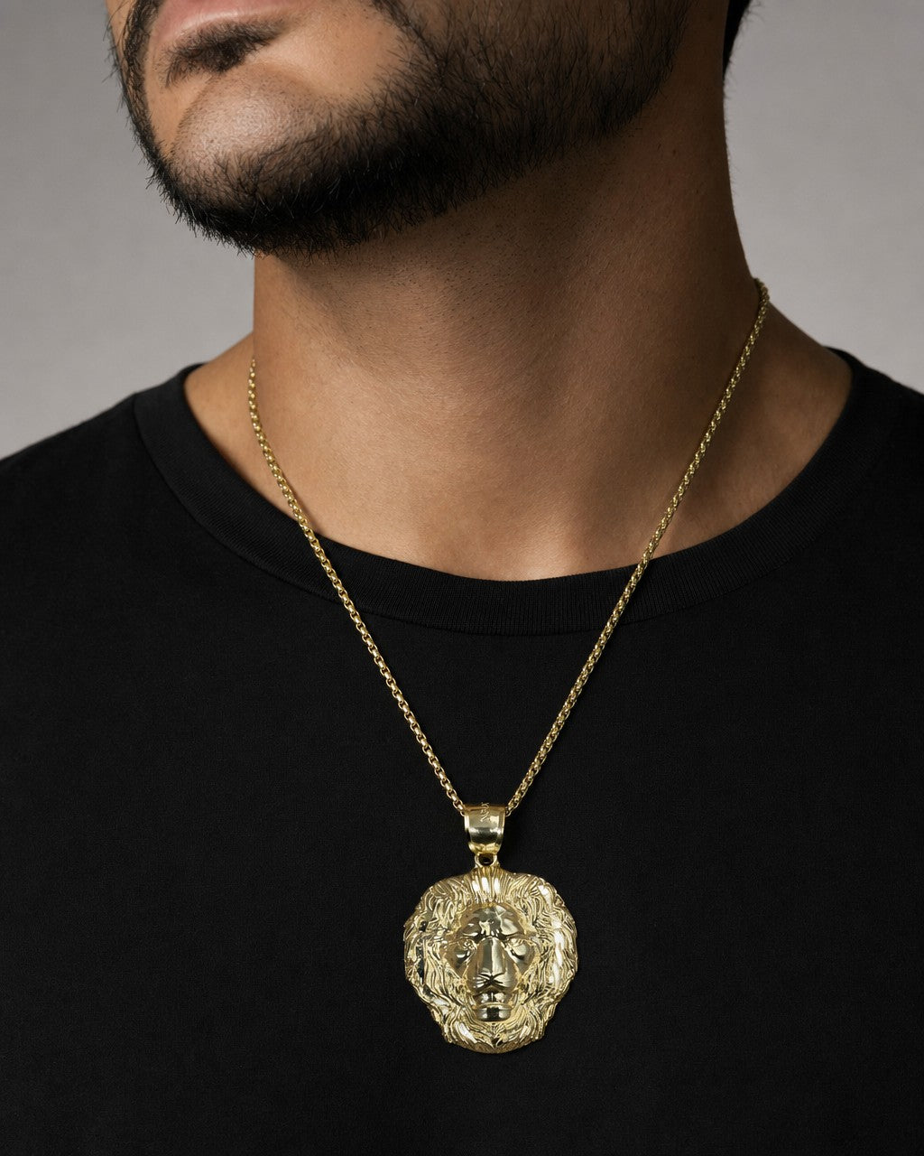 Male model wearing 10K Gold Lion Head Pendant