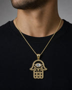 Male model wearing 10K Gold Hamsa Pendant with White Sapphire Stone