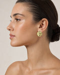 Female model wearing 18K Gold Wavy Circle Earrings